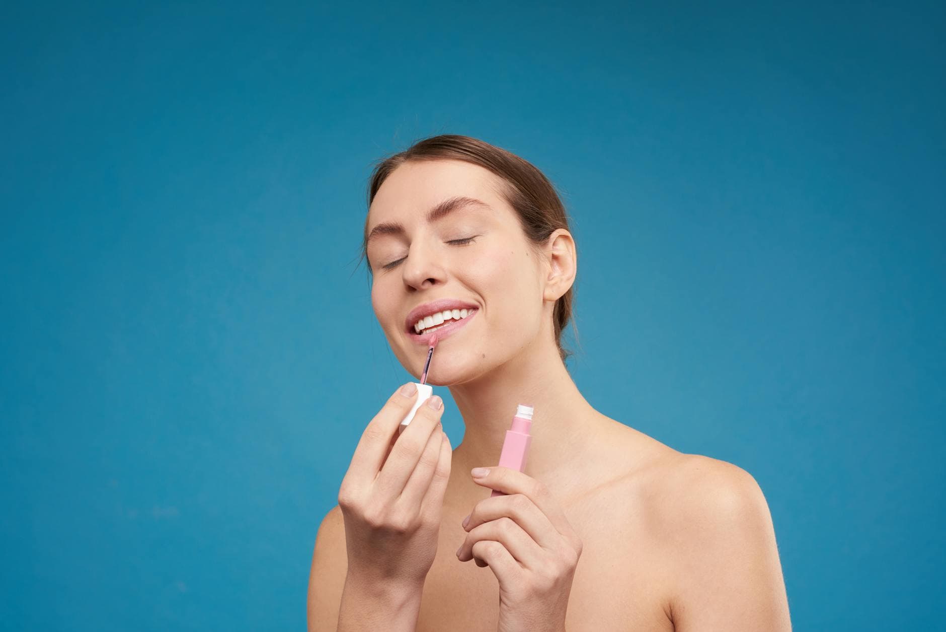 woman applying lipstick