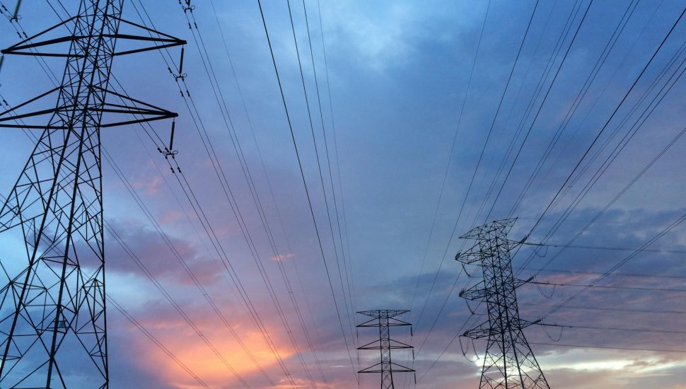 transmission tower under gray sky