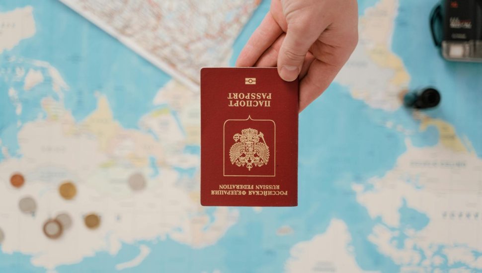 close up shot of a person holding a passport