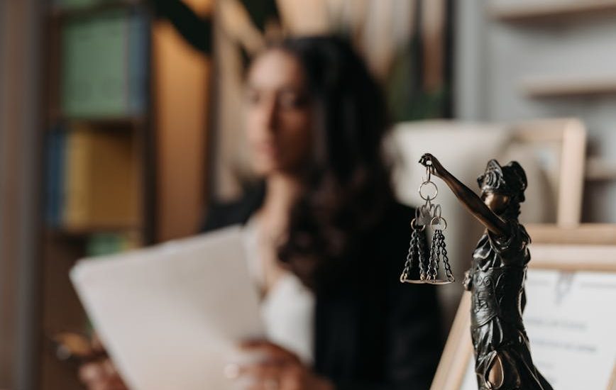 figurine of justice on table in office