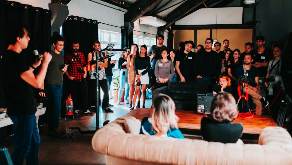 group of people standing inside room