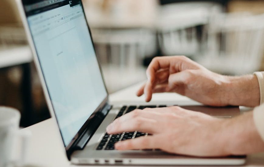 person using laptop computer