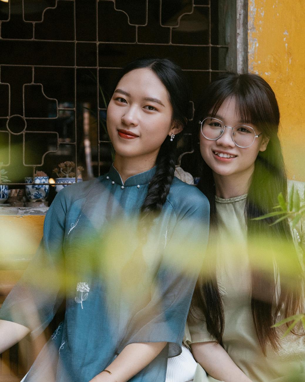 portrait of two women in elegant traditional attire
