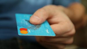 person holding debit card