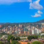 vibrant medellin cityscape under blue skies