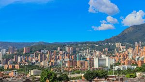 vibrant medellin cityscape under blue skies