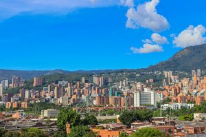 vibrant medellin cityscape under blue skies