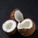 a close up shot of opened coconuts