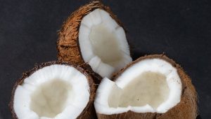 a close up shot of opened coconuts