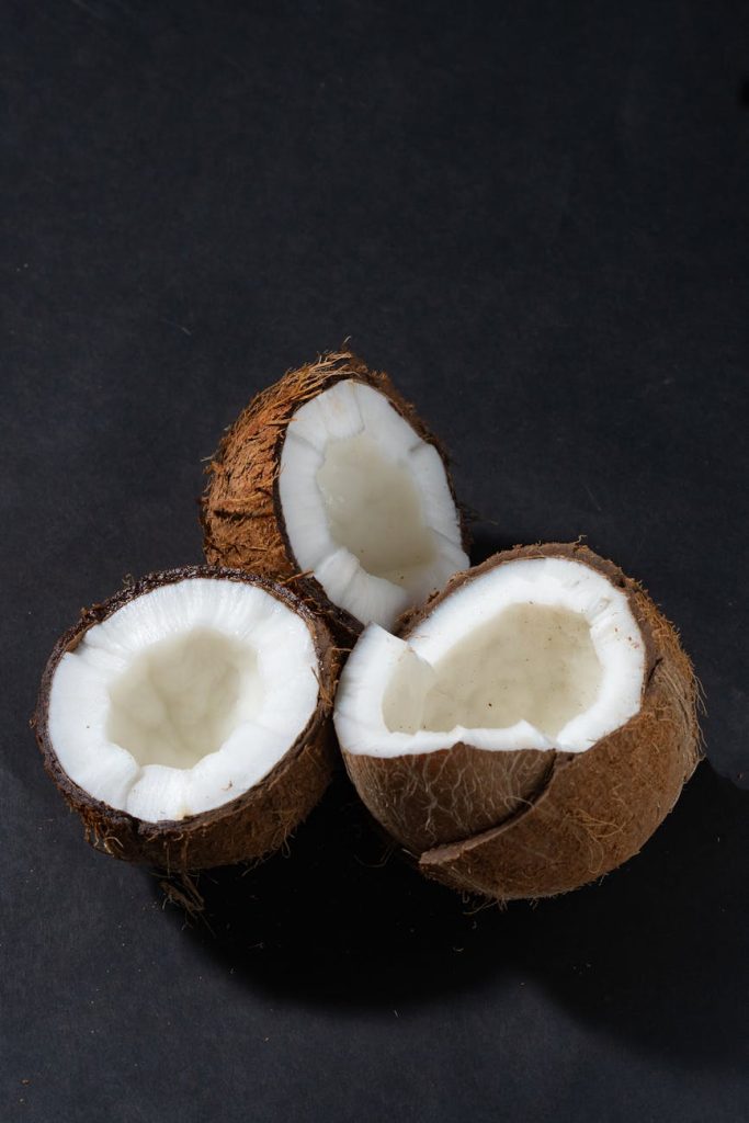 a close up shot of opened coconuts