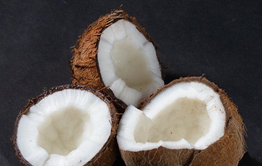 a close up shot of opened coconuts